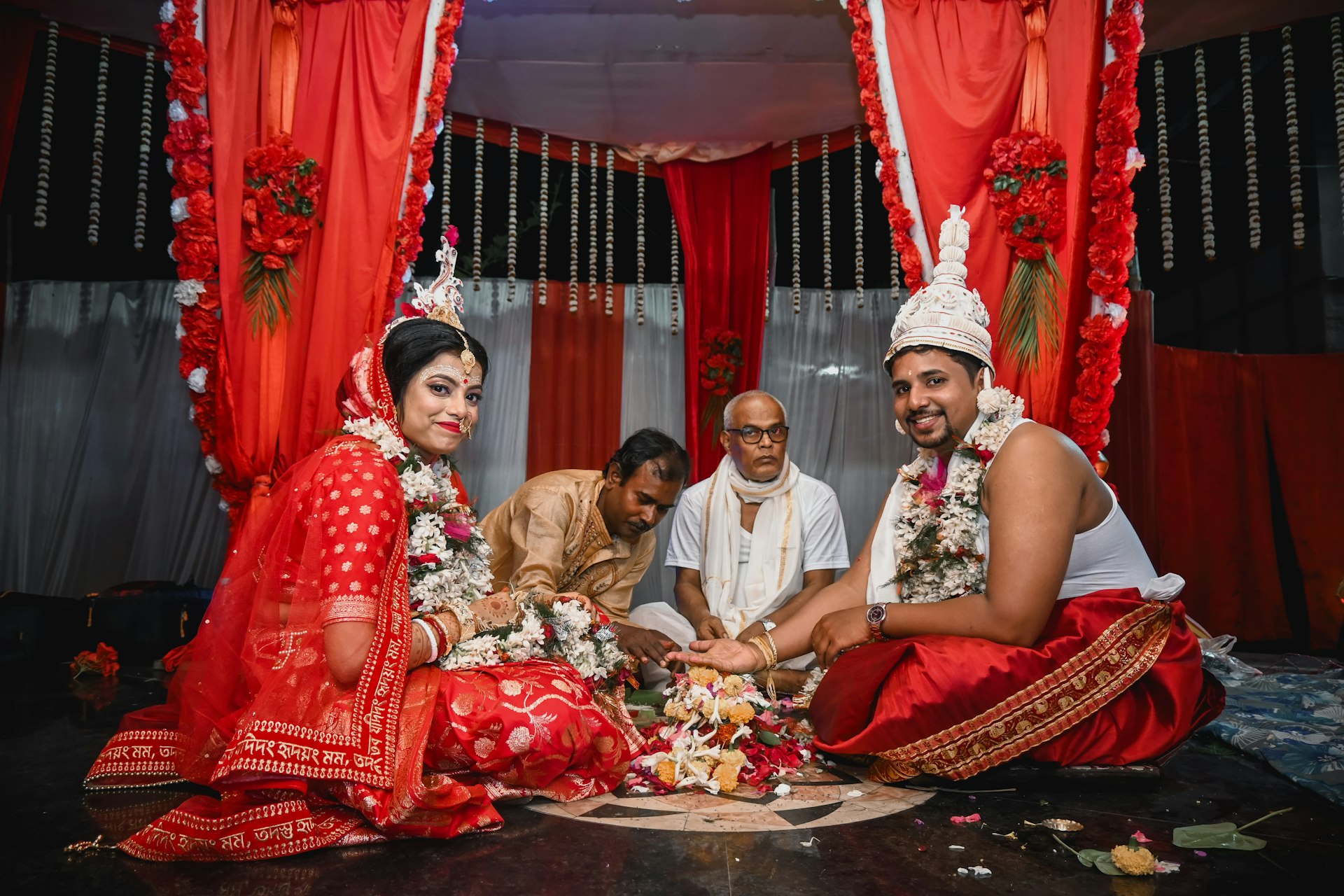A traditional bengali wedding ceremony is taking place.